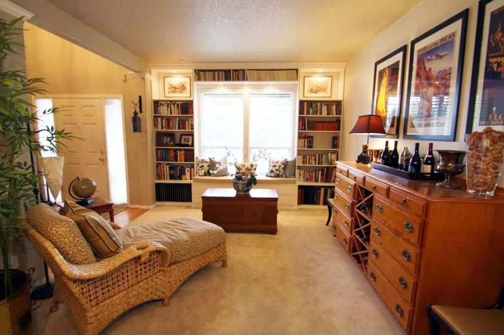 Living room after with bookshelves banquet and chaise