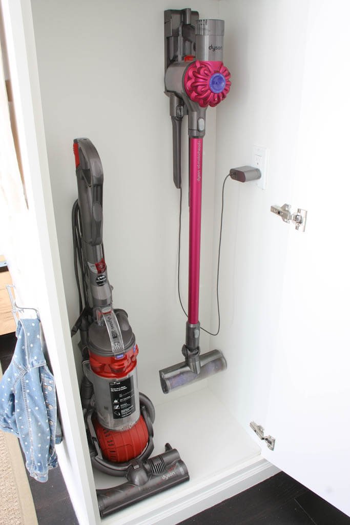 vacuums inside cleaning cabinet