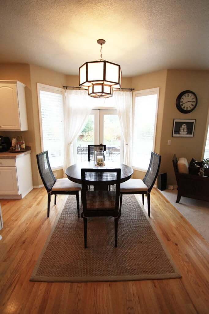Dining Nook after with french doors to back yard and custom chandelier