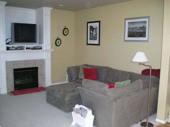 Family room with yellow walls grey couch