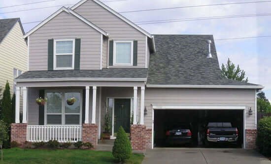 Front view of Portland house with planter baskets hanging from porch