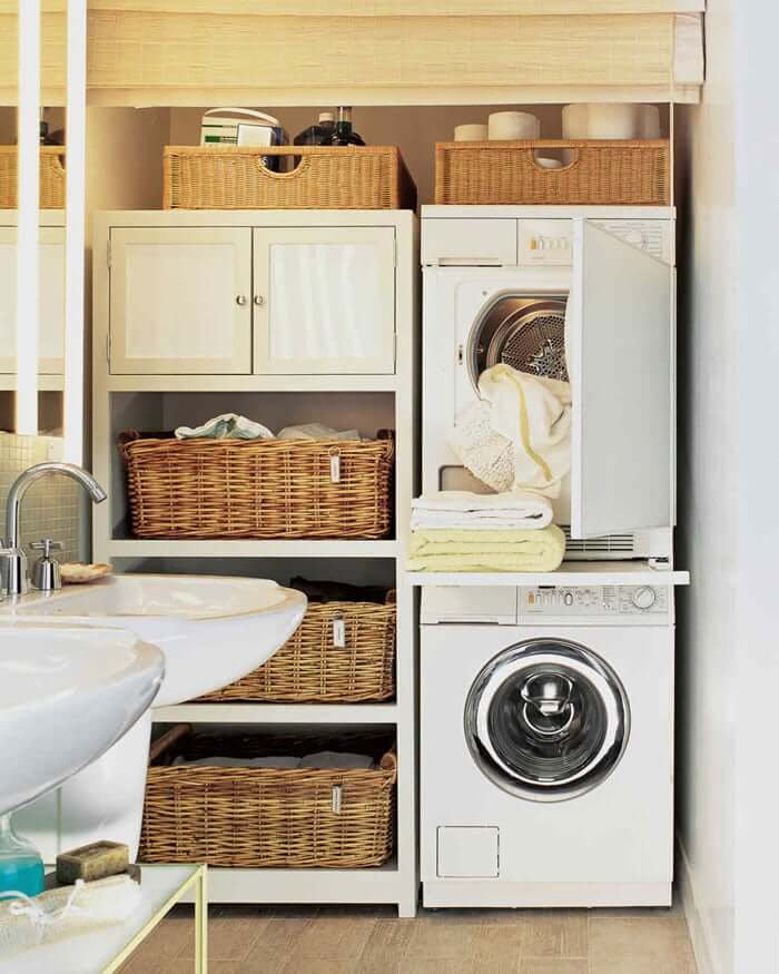 stacked washer and dryer with baskets on shelves