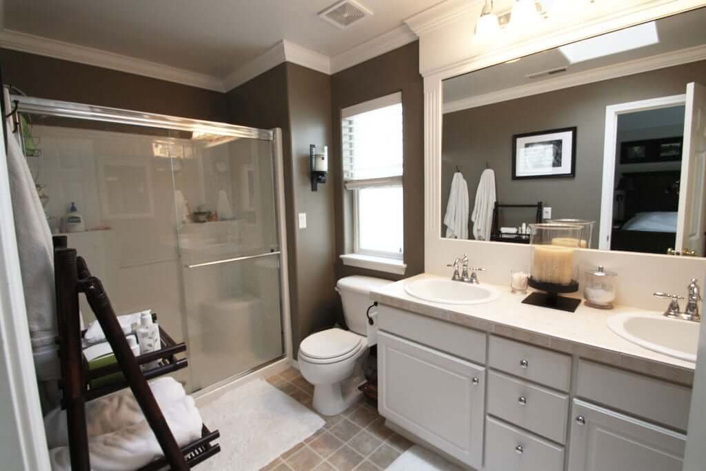 Master Bath after with grey-brown walls, white moldings and chrome fixtures