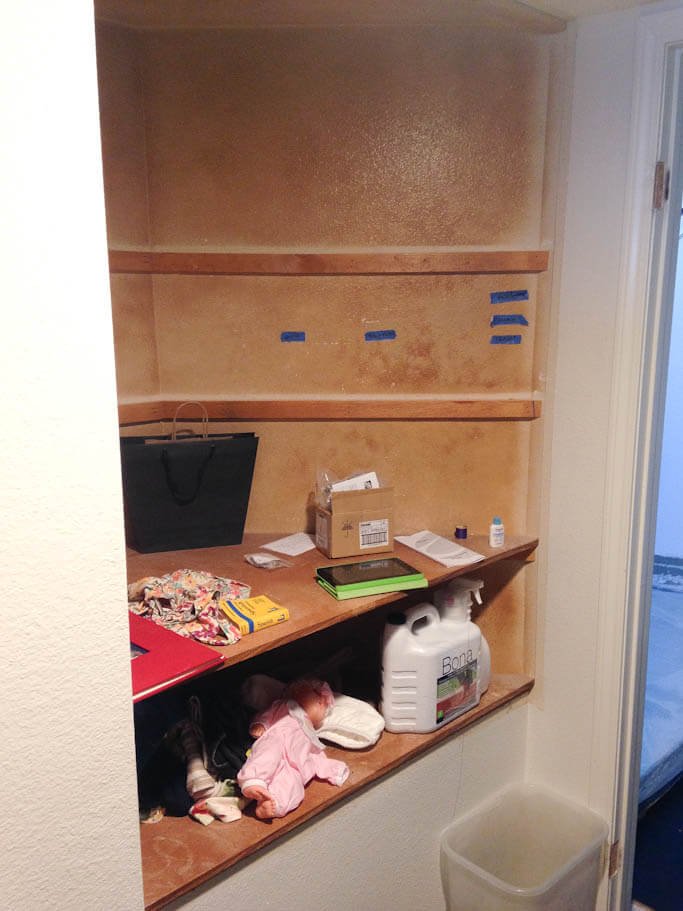 emptied cabinet with doors removed, testing out process of use