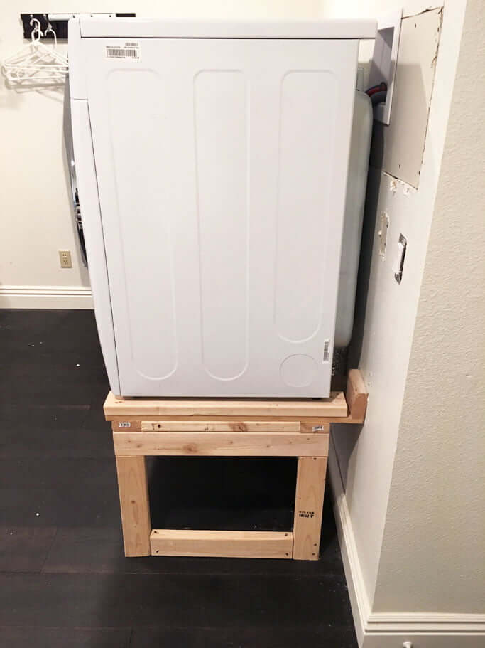 DIY raised washer and dryer on wood stand from the side