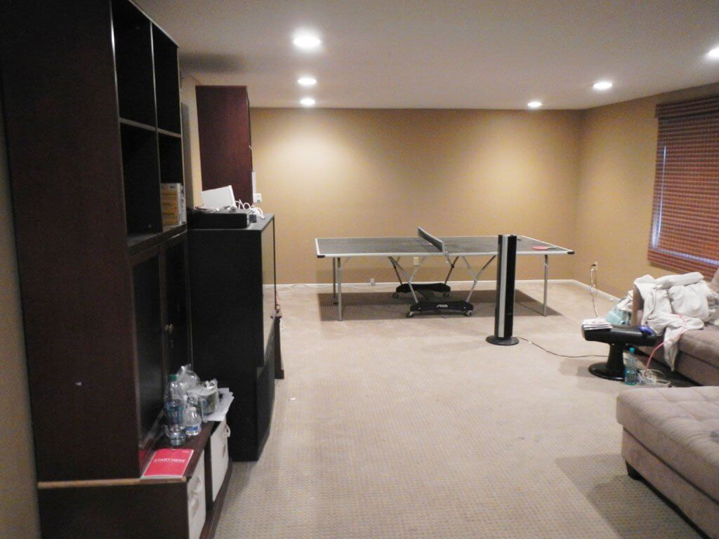 bonus room with tv and ping pong table