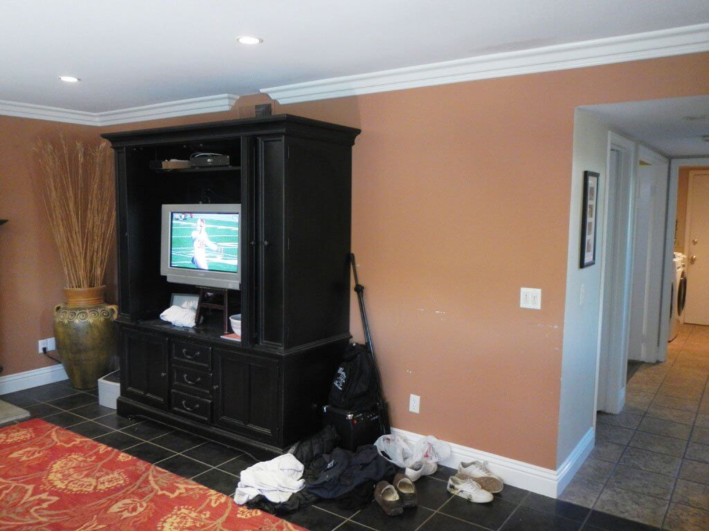 living room tv cabinet and view into hall