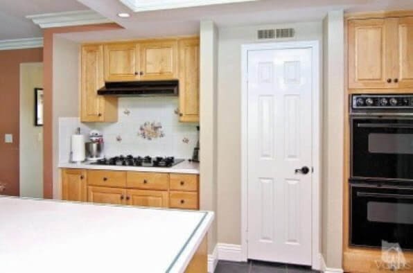 kitchen wall with stove and oven