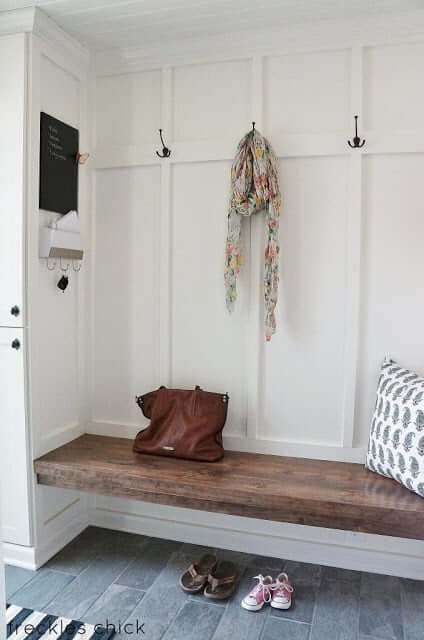 mudroom inspiration photo, white walls with wood bench