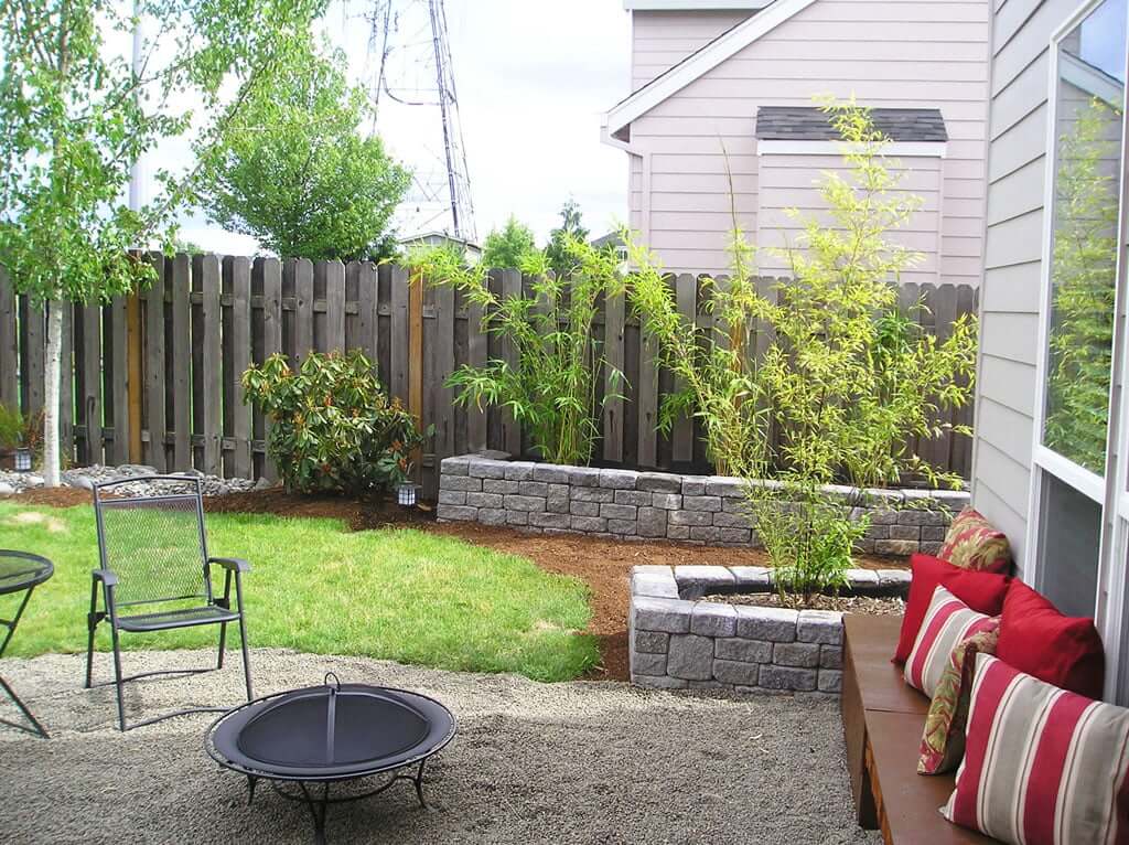 Gravel firepit area showing bamboo planters