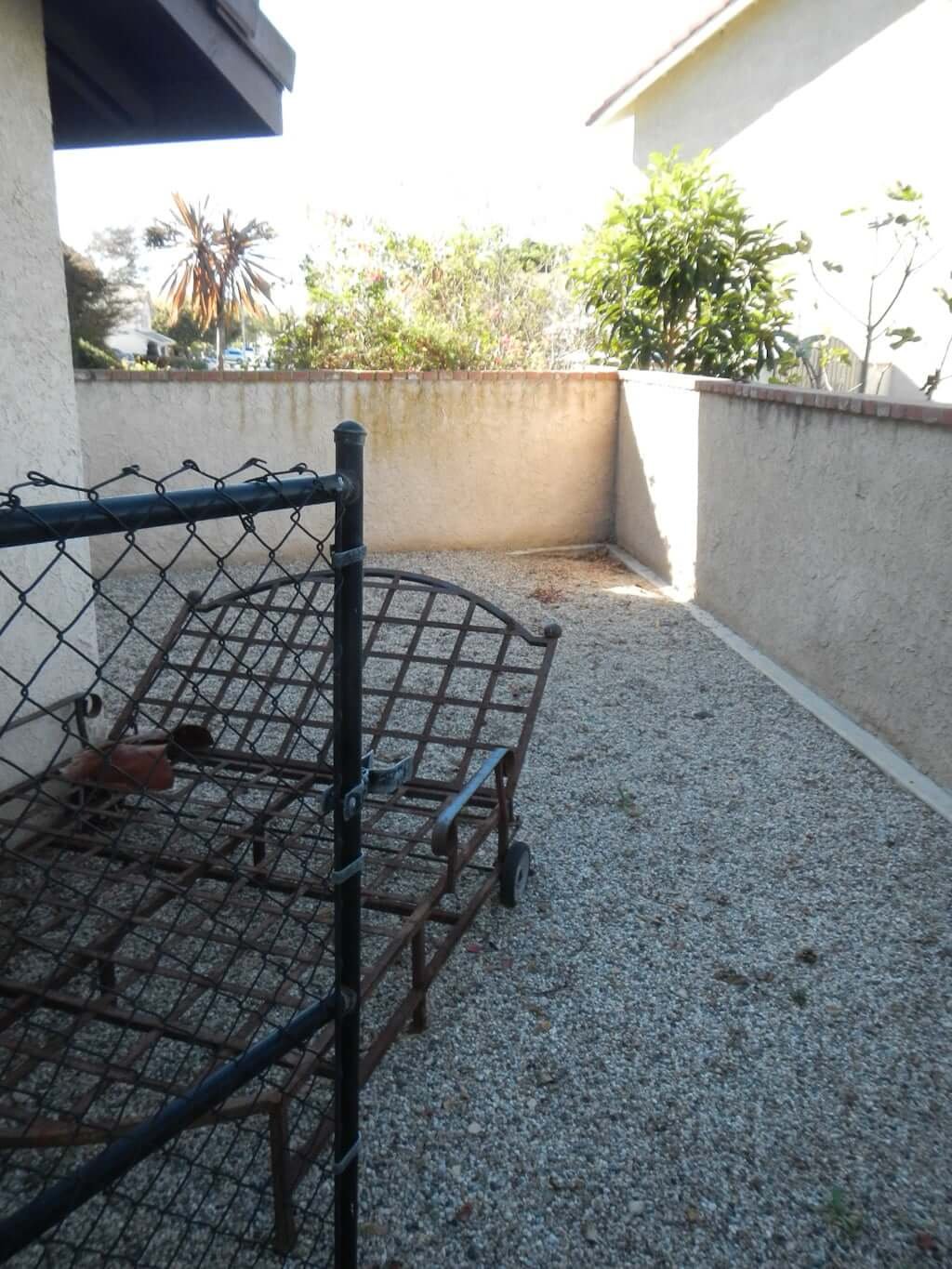 gate opening to dog run with gravel