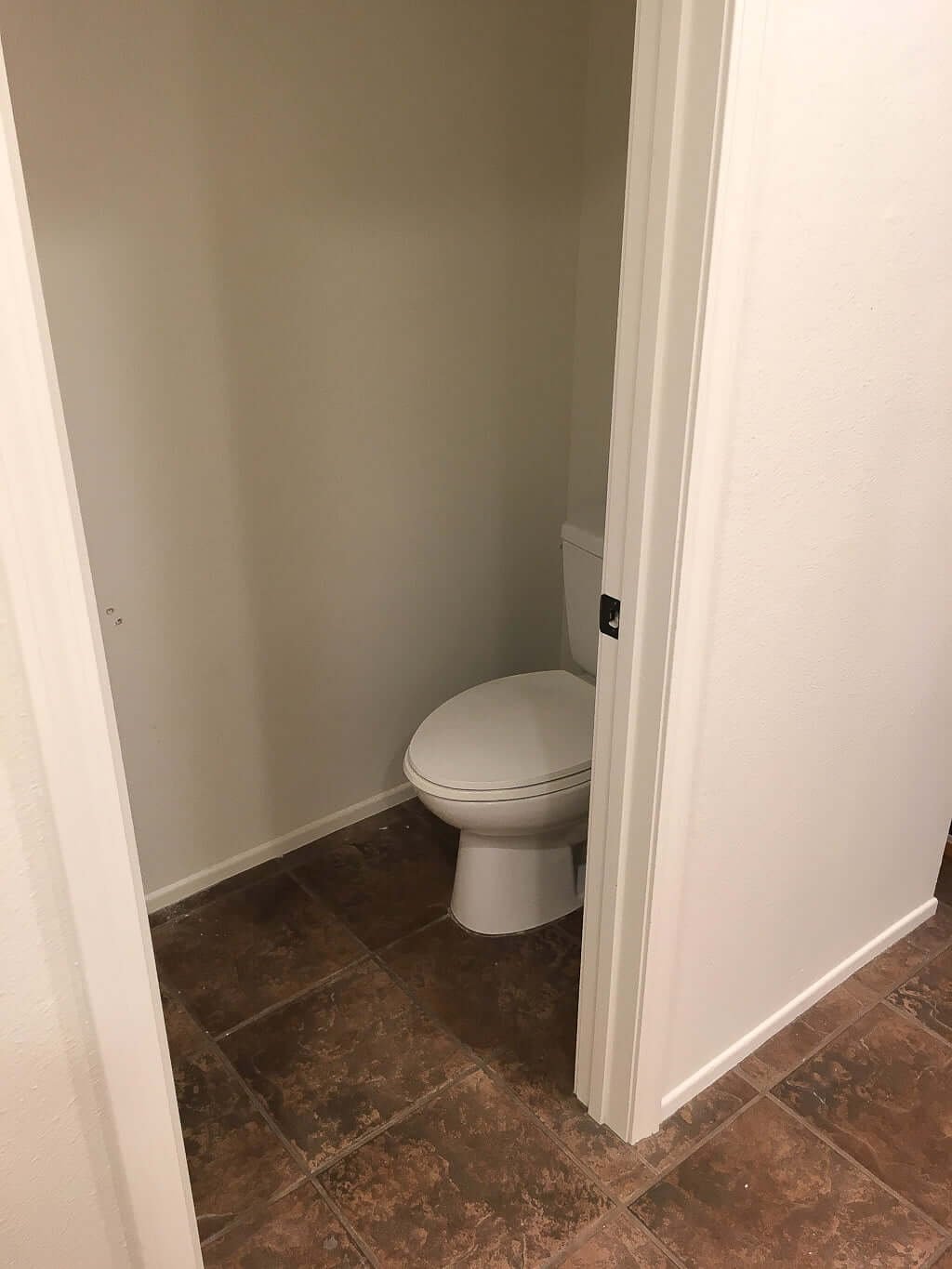 toilet in small W.C. with door opening