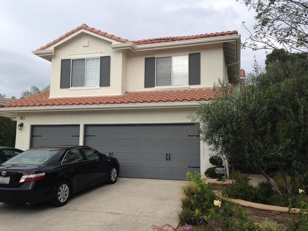 house with dark grey painted garage 