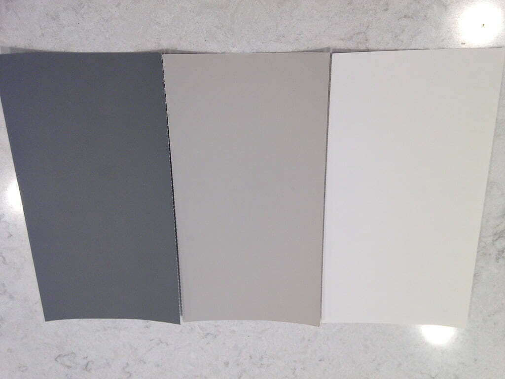 three grey and white paint color swatches