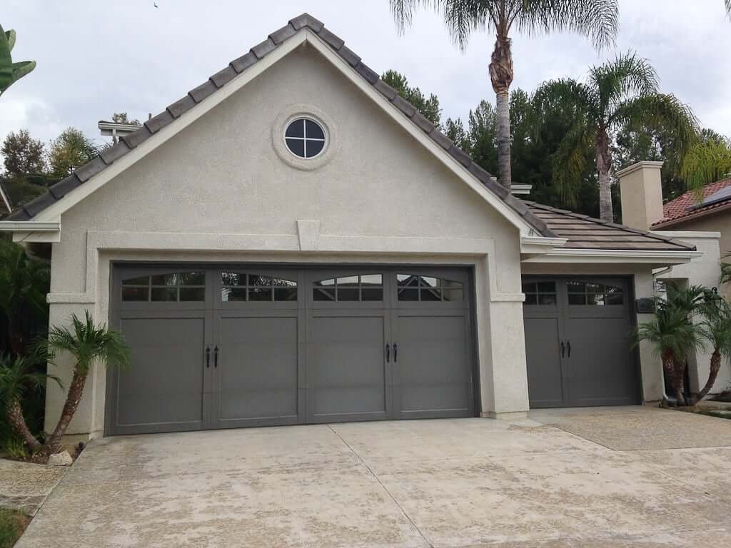 garage doors dark grey on grey house