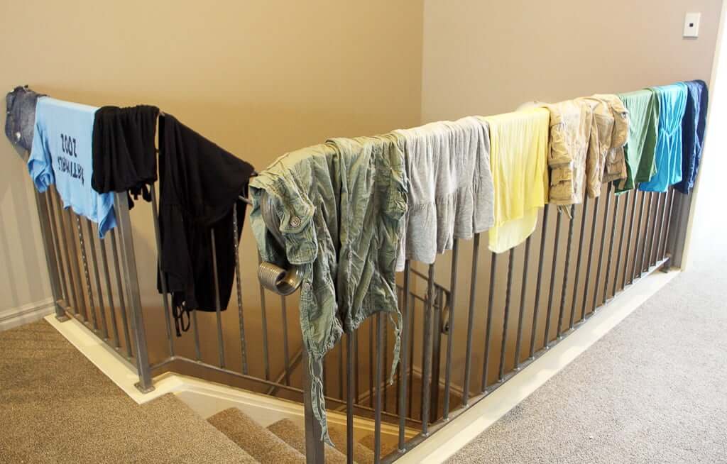 clothes drying over stairway railing