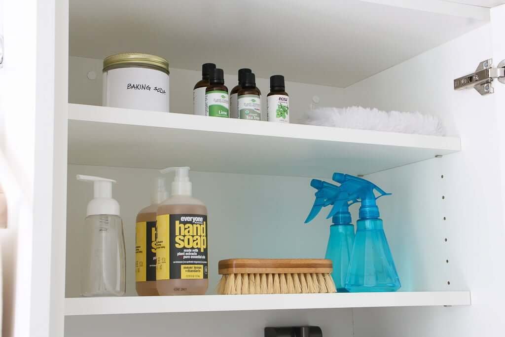 natural cleaning products on two shelves