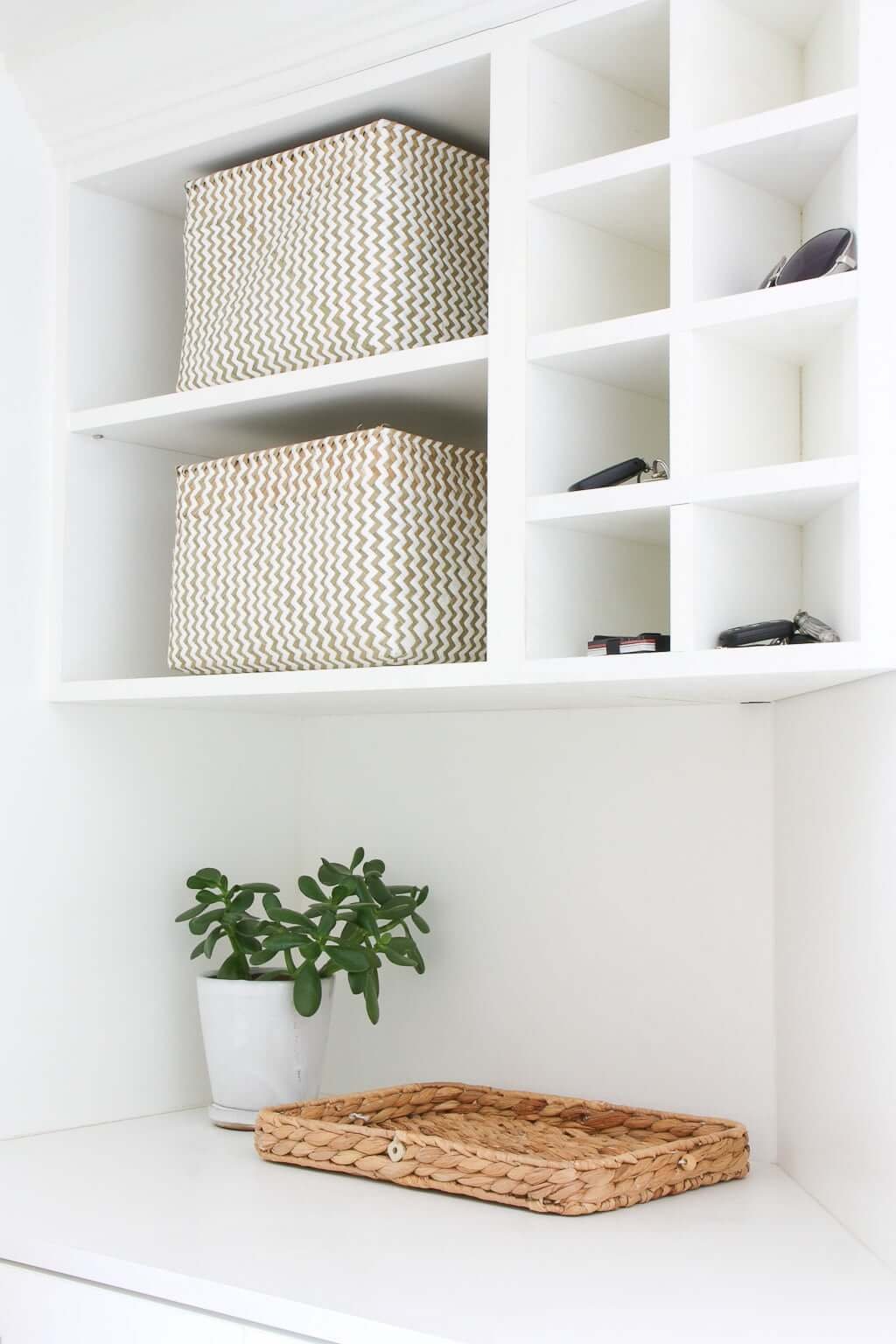 mudroom cubbies with storage shelves and counter