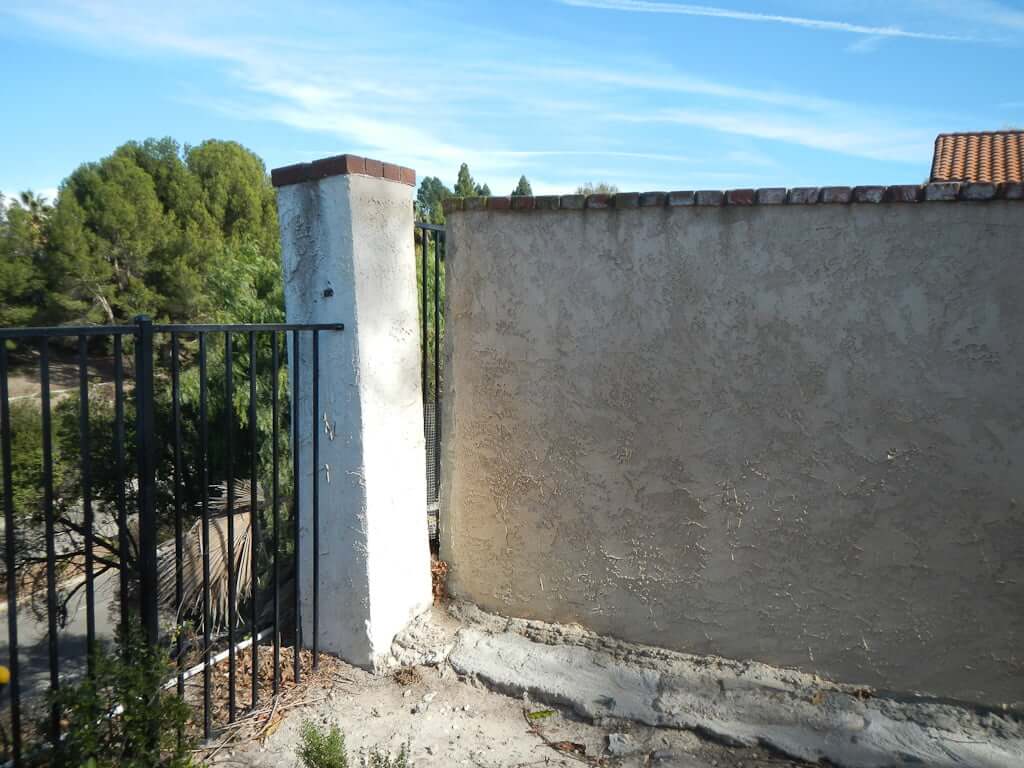 Pillar detached from wall and leaning