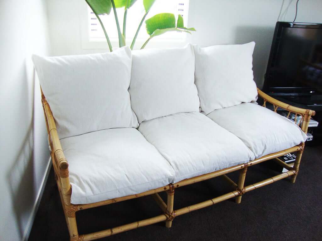 bamboo couch with white couch cushions