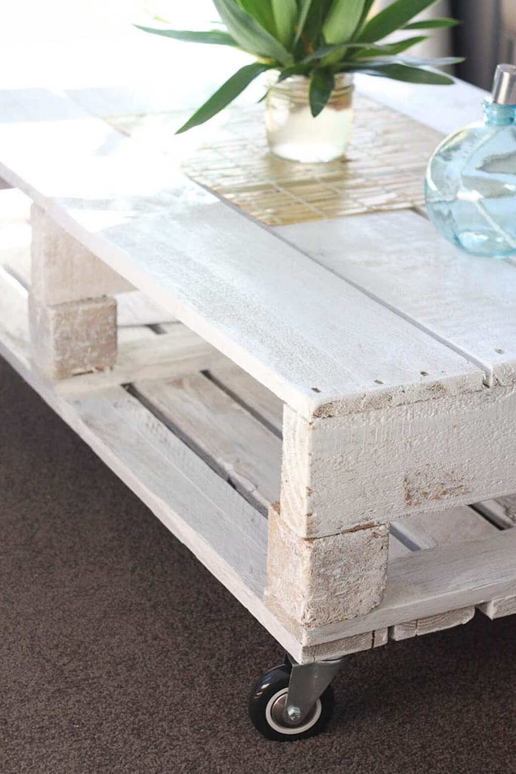 White DIY Pallet coffee table with wheels
