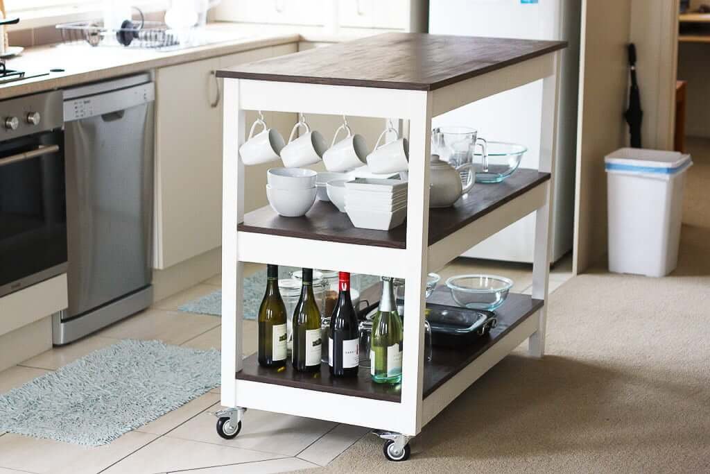 Kitchen Island cart with dishes and wine