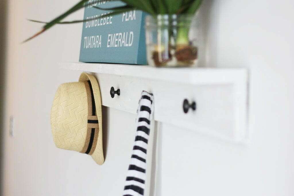 Wall shelf with hat and hanging bag