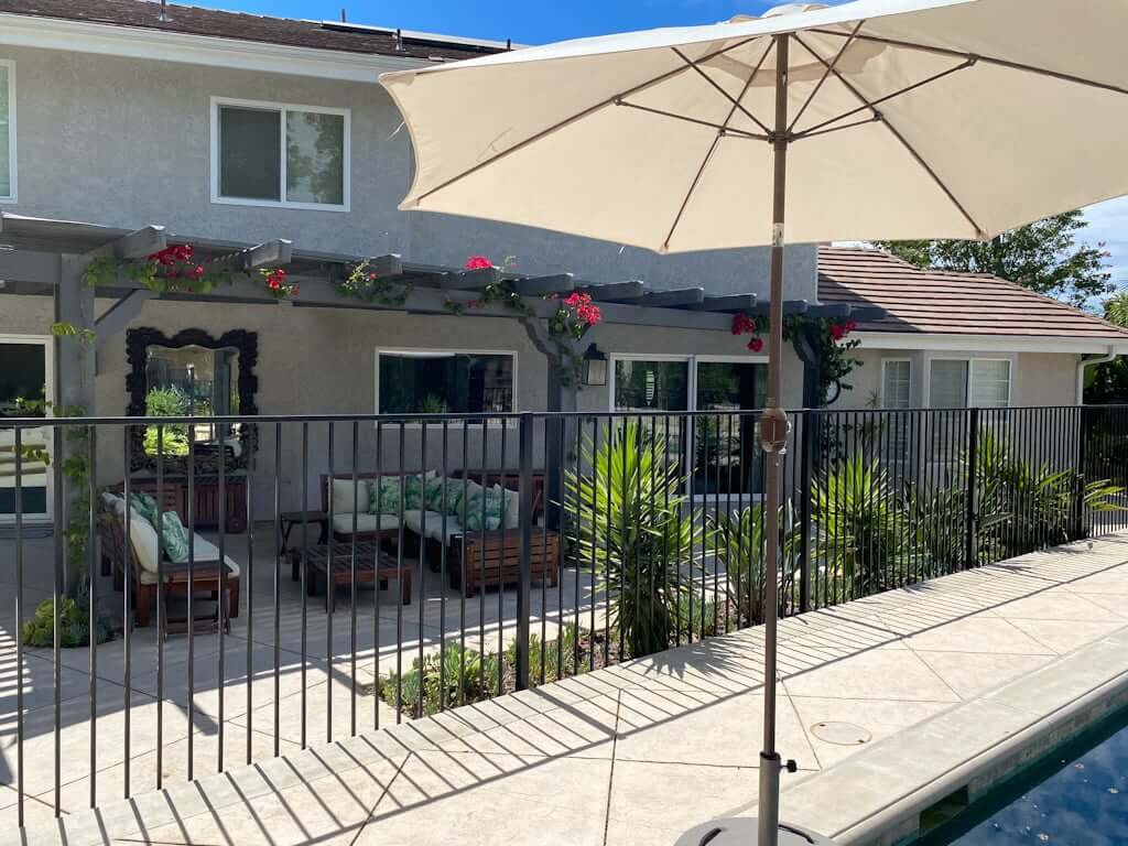 view of back of house with updated hardscape and fresh paint