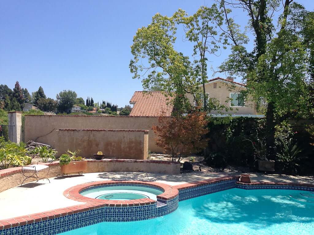 backyard with pool and trees