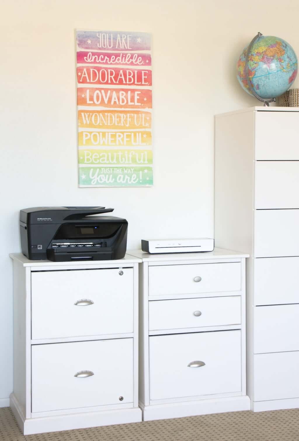 two file cabinets in homeschool room with laminating machine and printer-copier on top