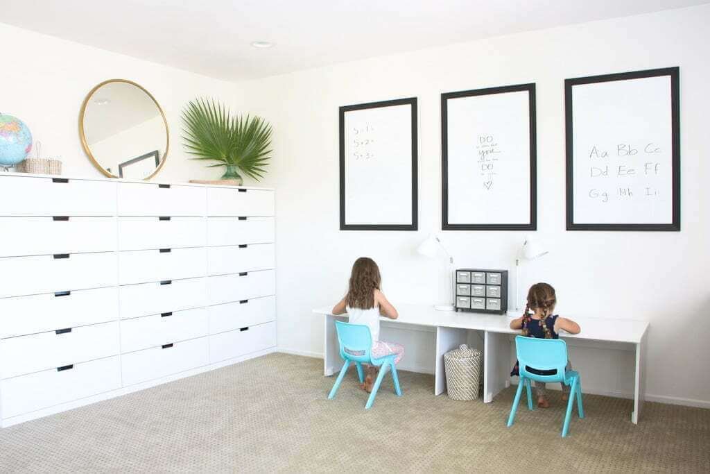 kids at white double desk with white drawers in craft room