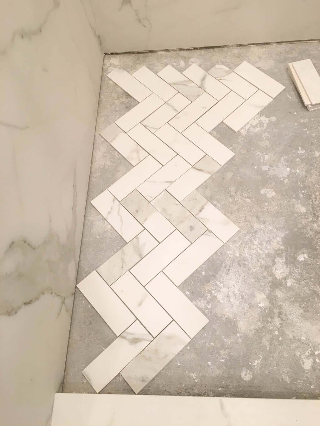 shower floor tile in herringbone pattern