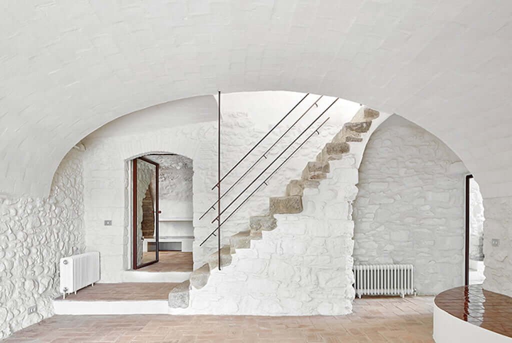 stone walls painted white in foyer