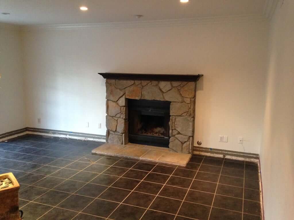 stone tile fireplace in dining room