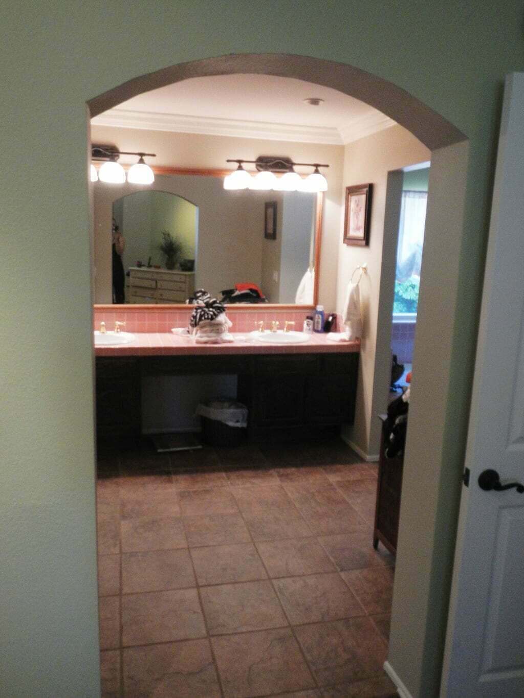double sink vanity before, old with pink tile