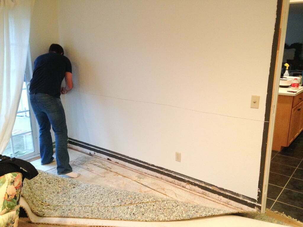 man cutting drywall horizontally