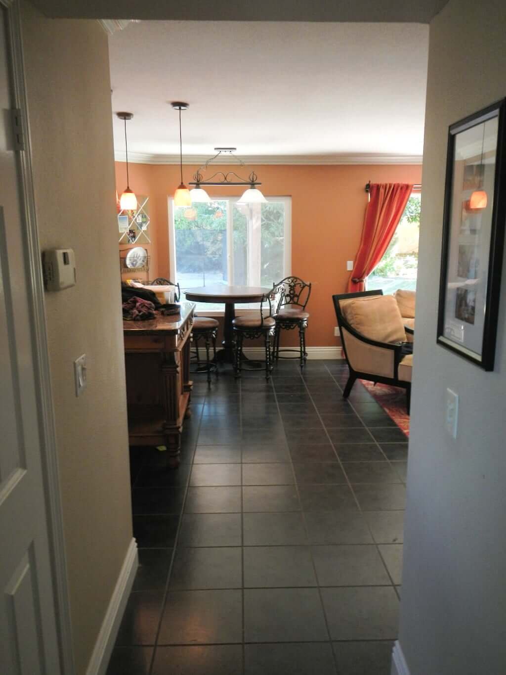 kitchen remodel before photo, hallway to kitchen with black tile flooring