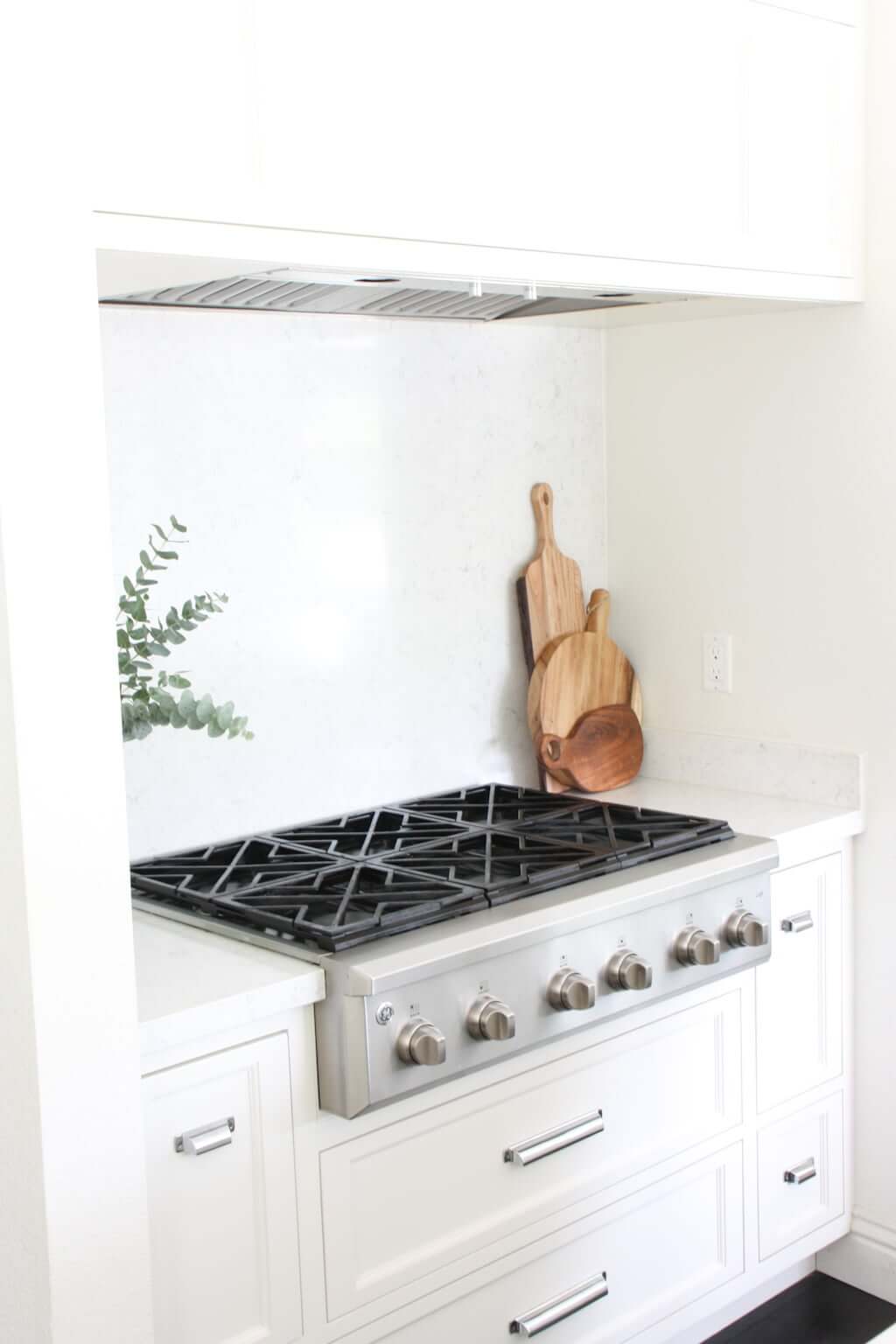 stove with white cabinetry