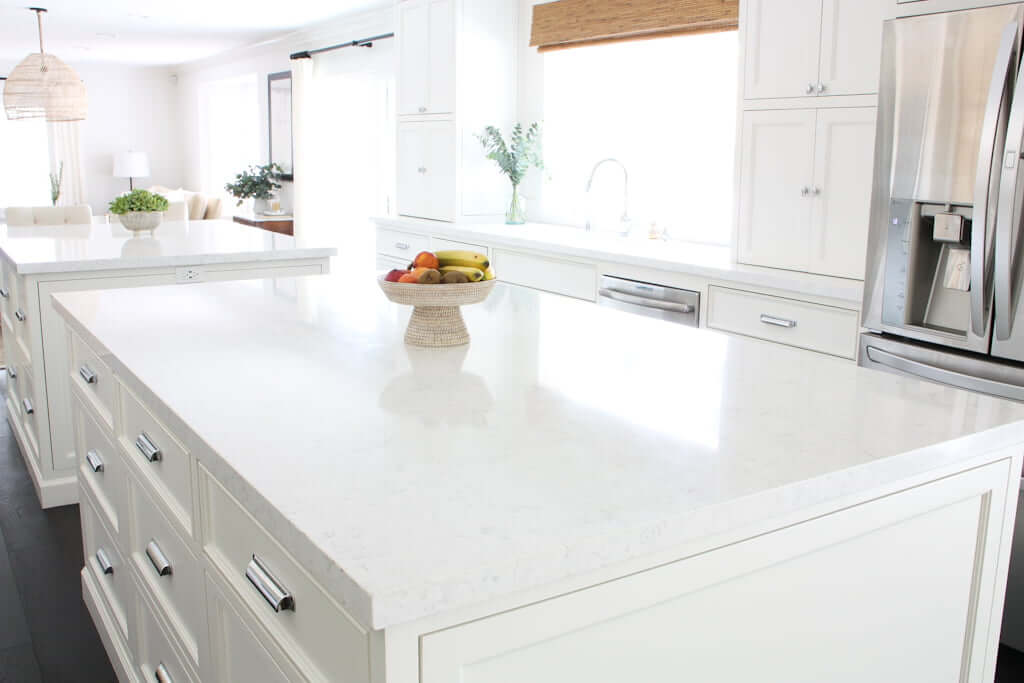 white galley kitchen with two kitchen islands in middle, after kitchen extension
