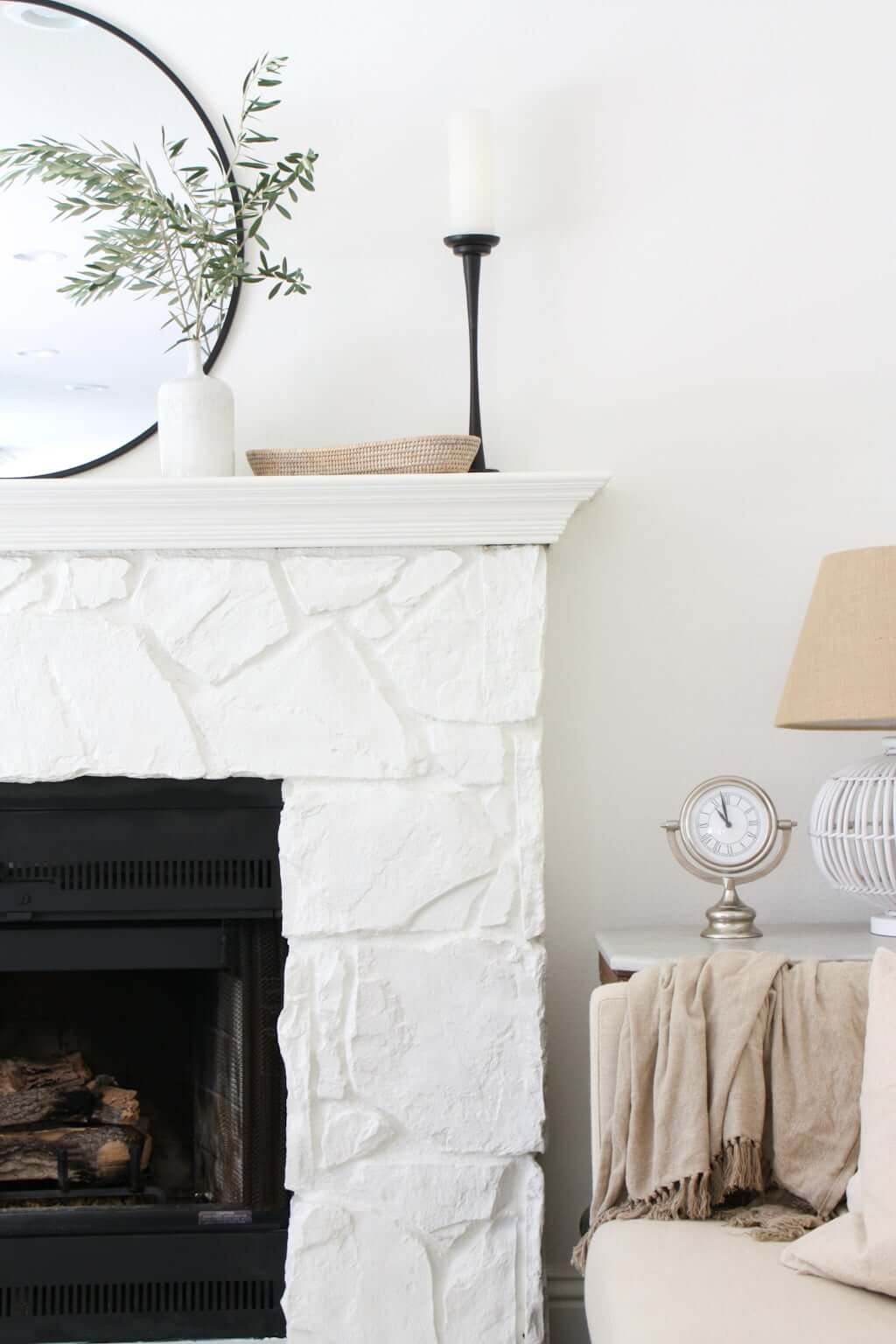 fireplace mantel with white stone fireplace in living room