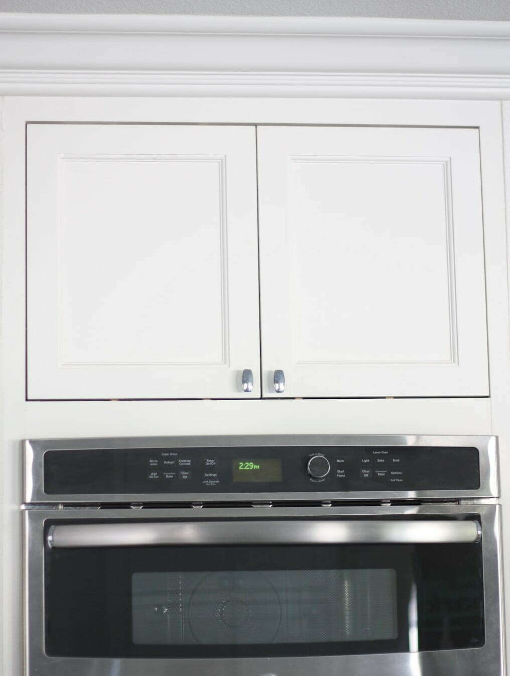 closed cabinet drawers above oven