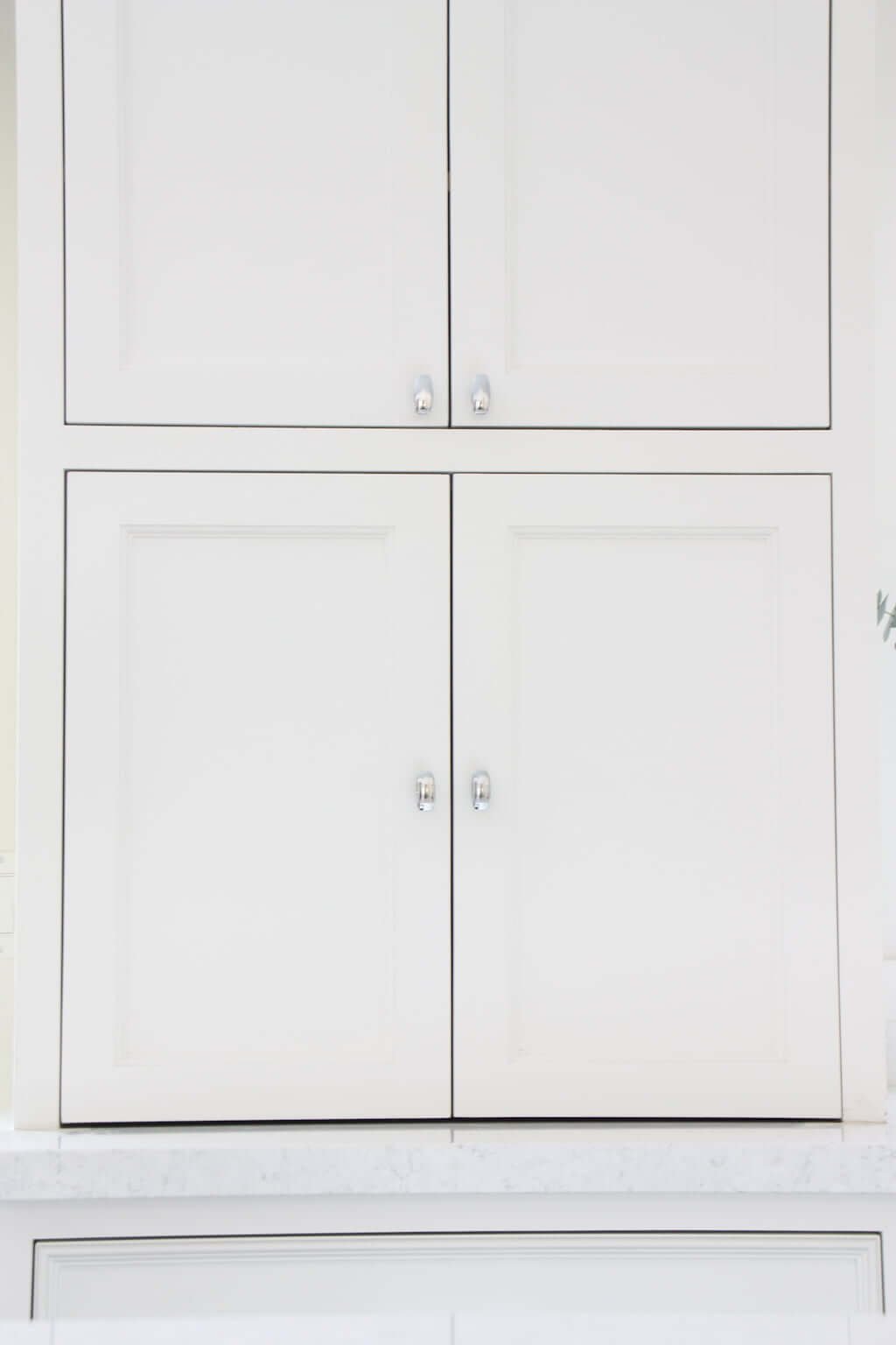 appliance cabinet on counter with doors closed