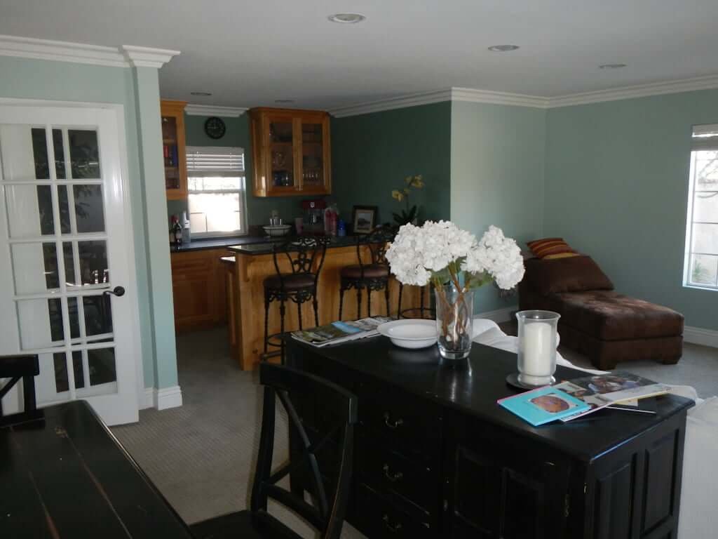 living room with bar area showing in background