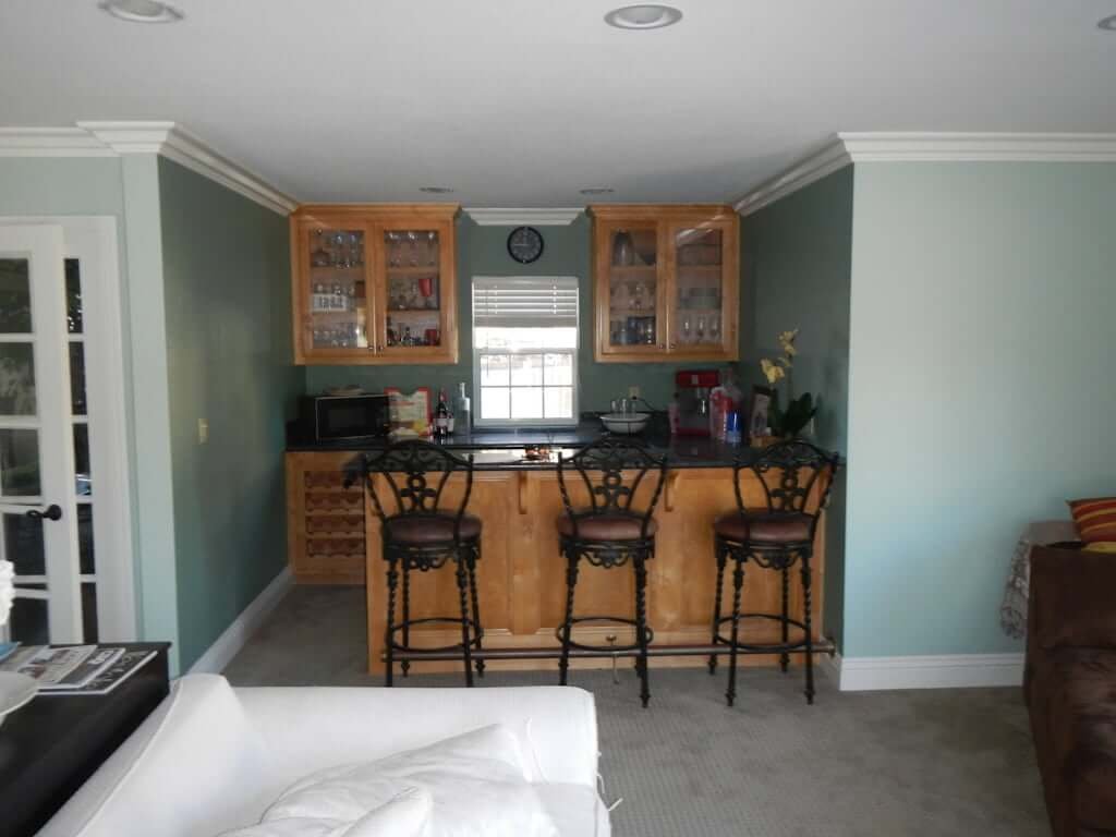 bar area before, with wood cabinets