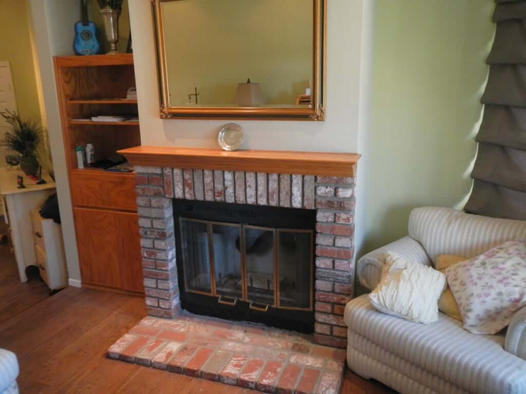 brick fireplace before, in sitting room