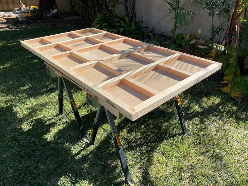 DIY platform bed wood headboard with supports on table