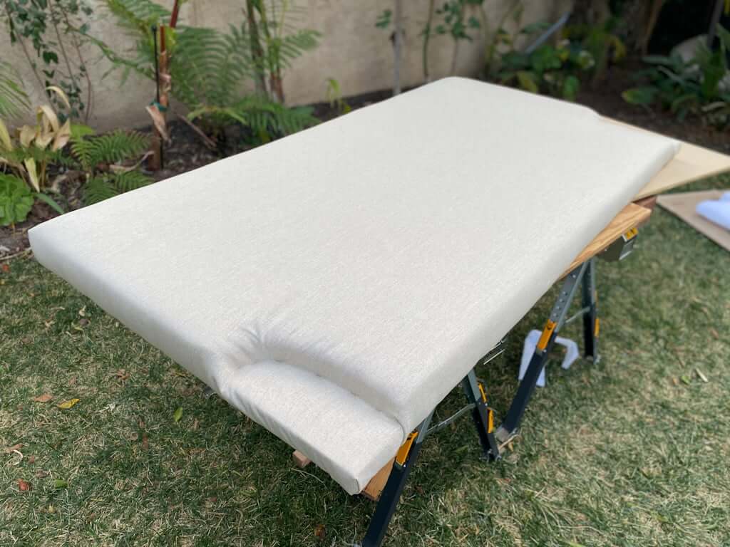 DIY upholstered platform bed headboard on sawhorse