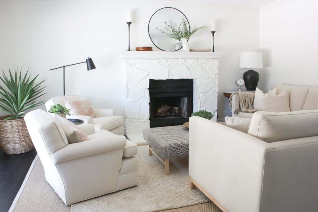 living room with dark hardwood floors and light rugs