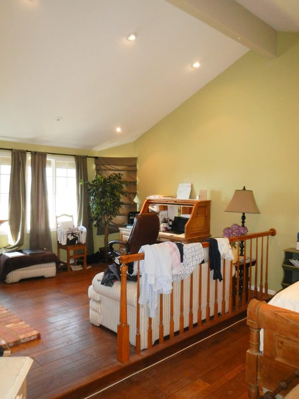 light hardwood floors in bedroom sitting area before being sanded and stained dark