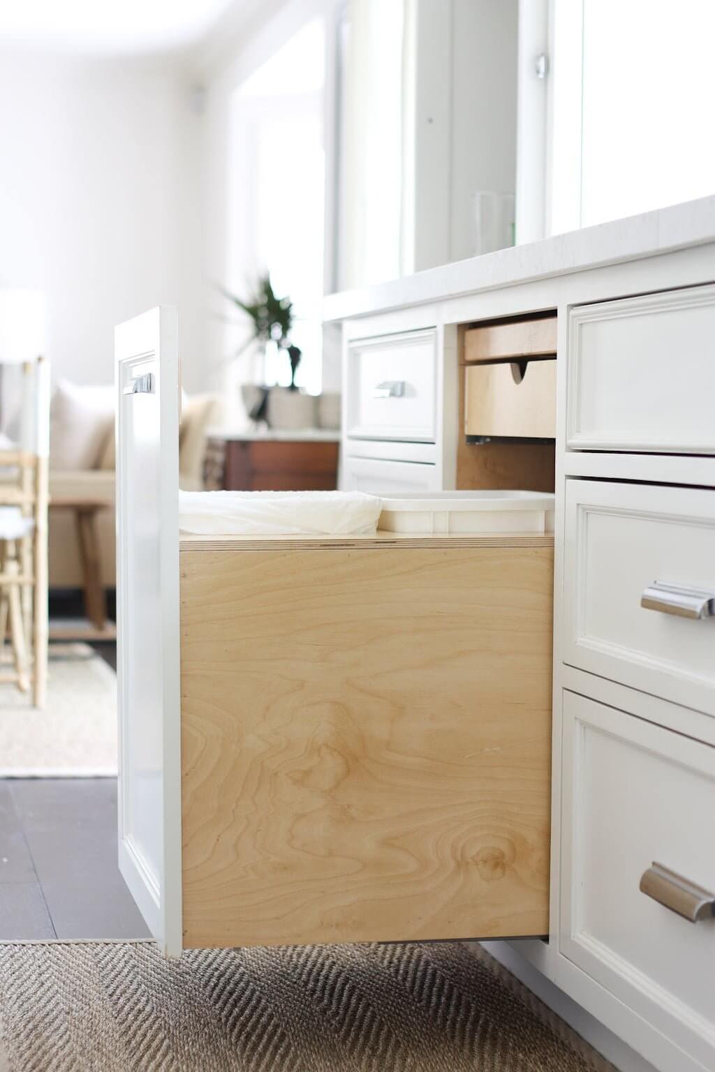 kitchen storage idea with trash and recycle pull out bin drawer